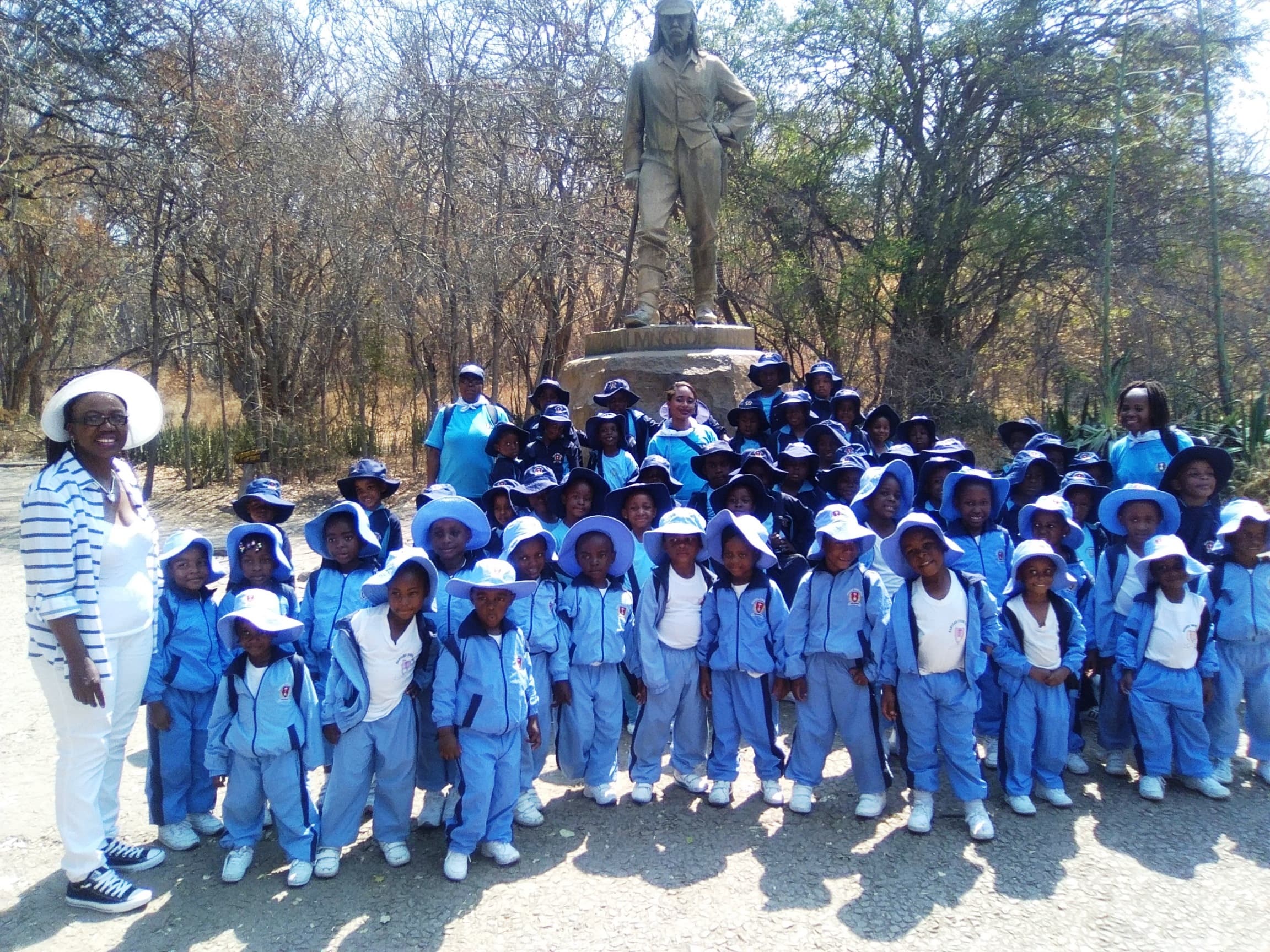 Harvard Junior pupils gathered at the David Livingstone statue at Victoria Falls