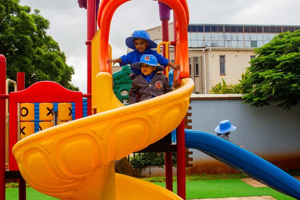 Harvard Junior School pupils playing together on the playground