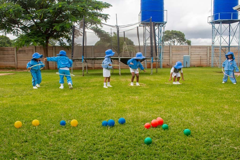 A Harvard Junior School pupil playing joyfully in the school grounds